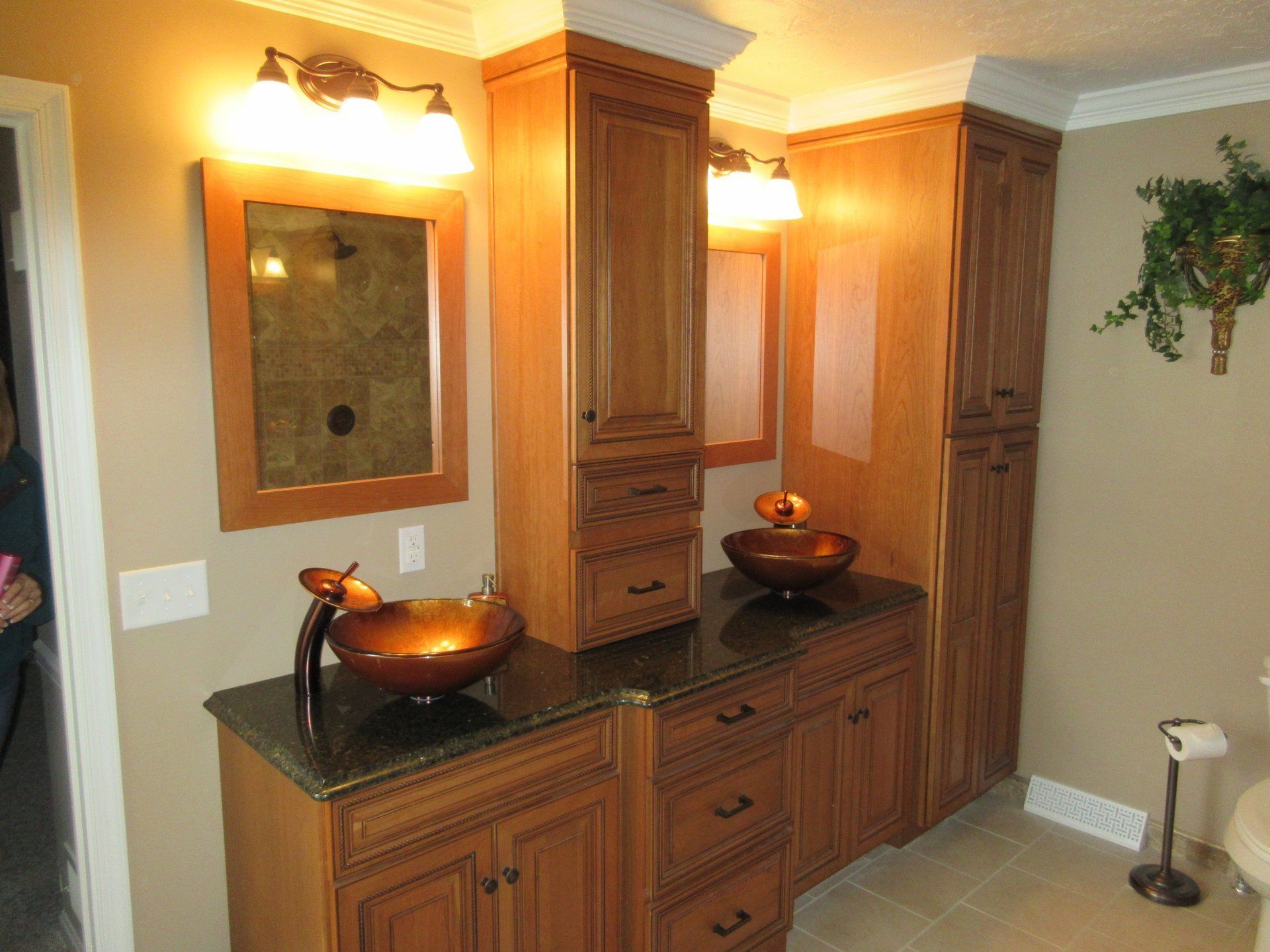 A bathroom with two sinks and a mirror