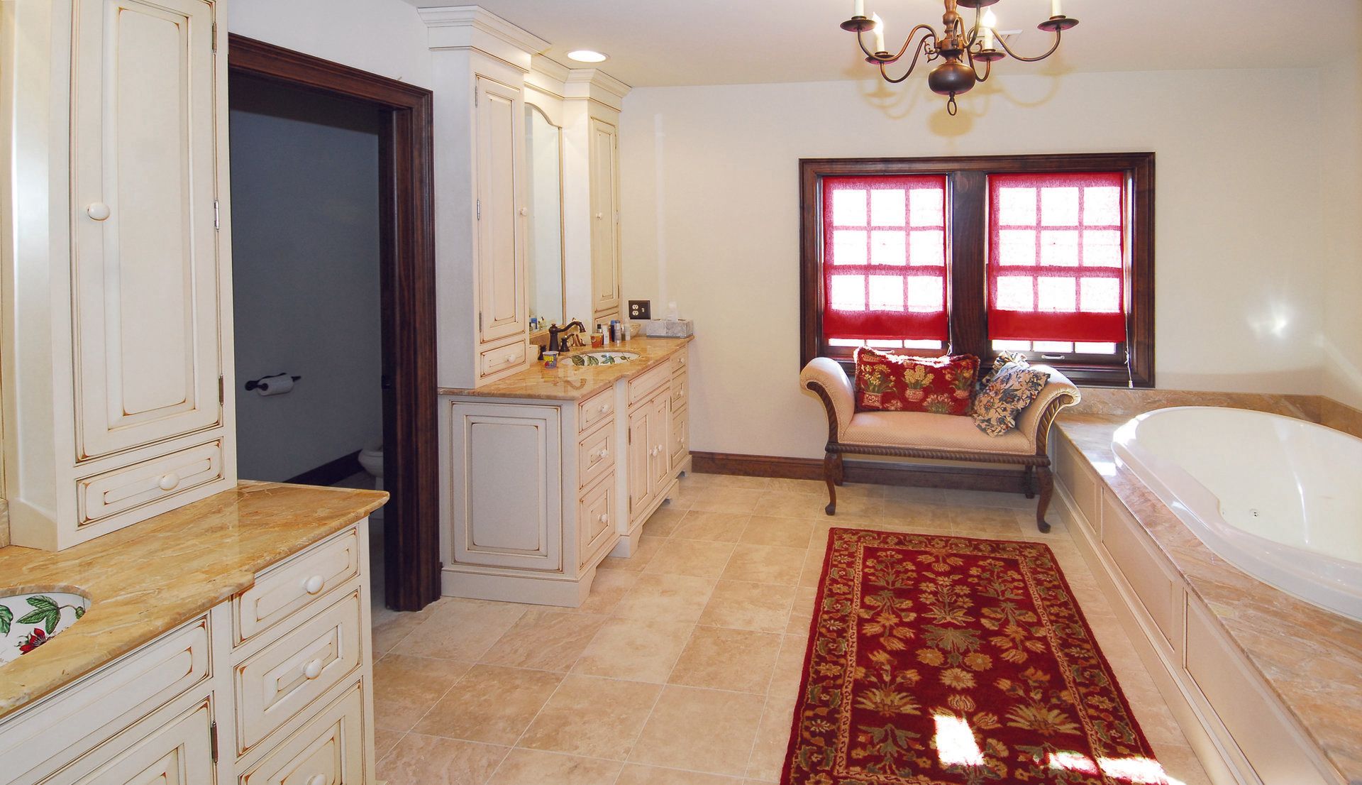 A bathroom with two sinks and a bathtub