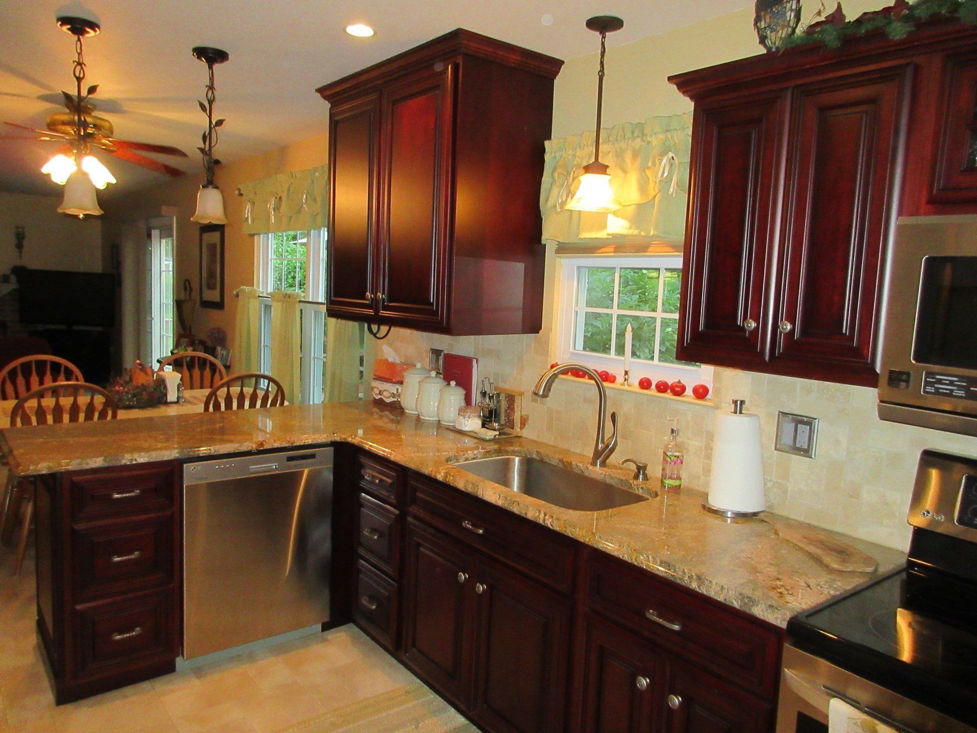 A kitchen with stainless steel appliances and granite counter tops