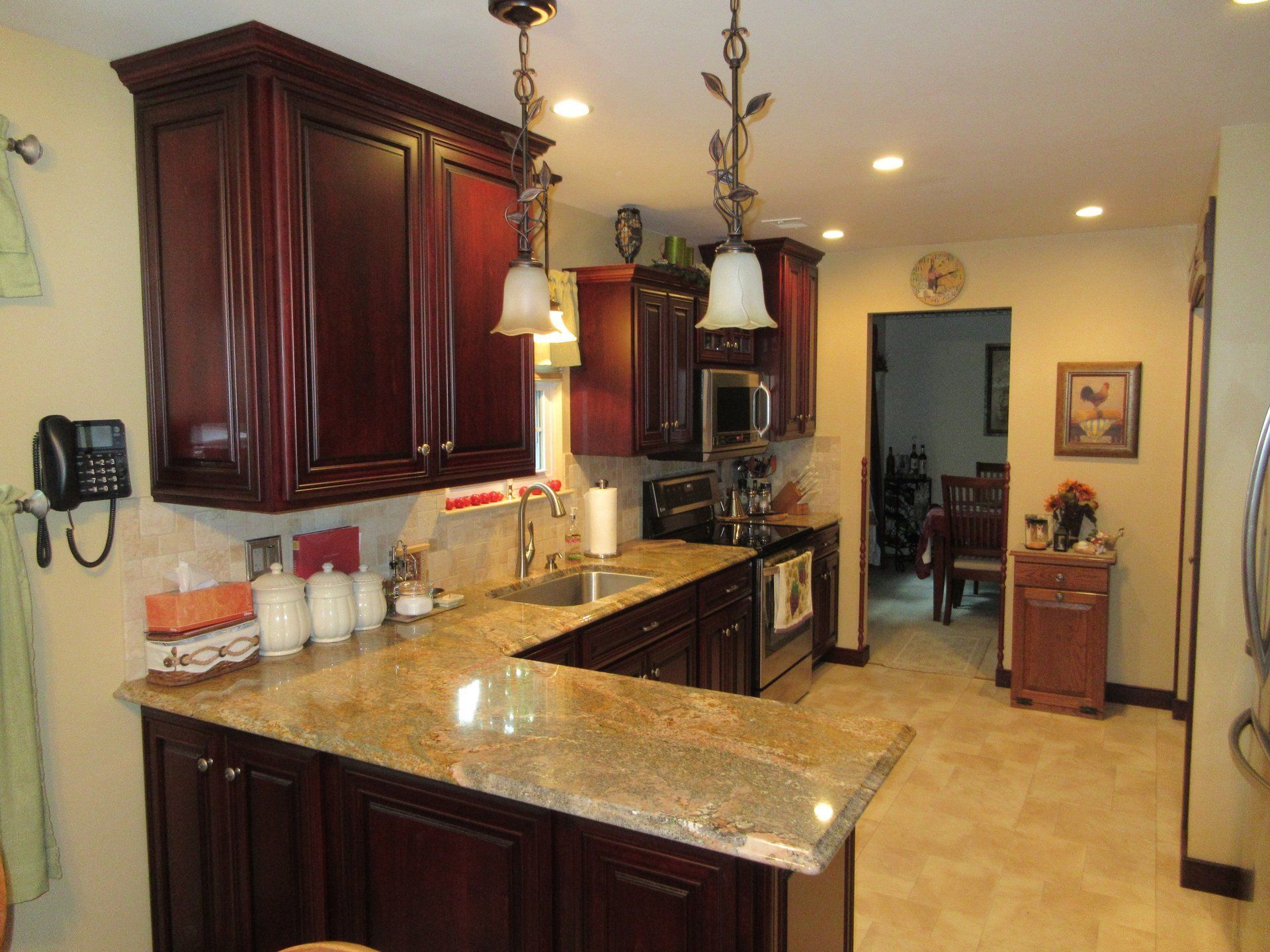 A kitchen with stainless steel appliances and granite counter tops