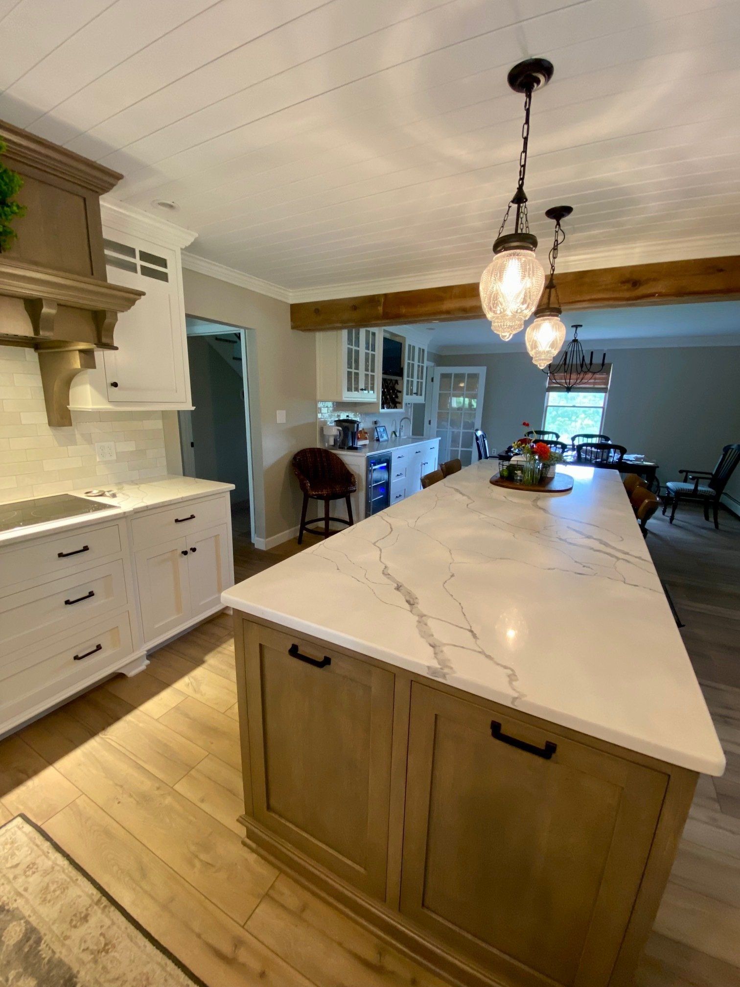 There is a large island in the middle of the kitchen.
