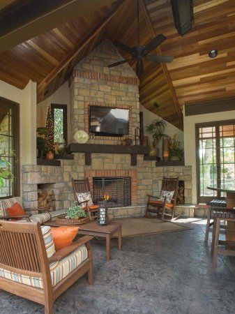 A living room with a fireplace and a flat screen tv