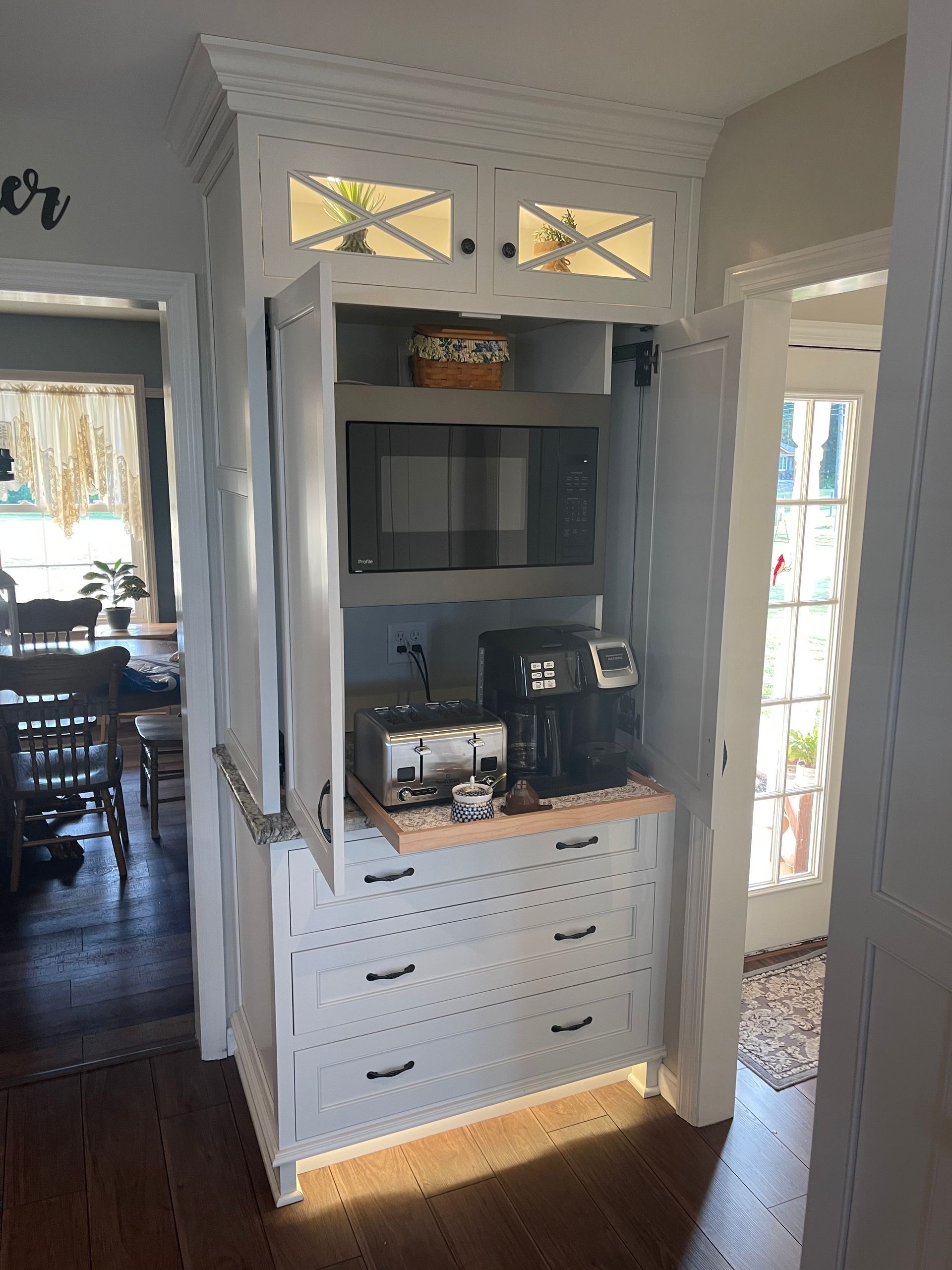 A kitchen with a microwave and a coffee maker