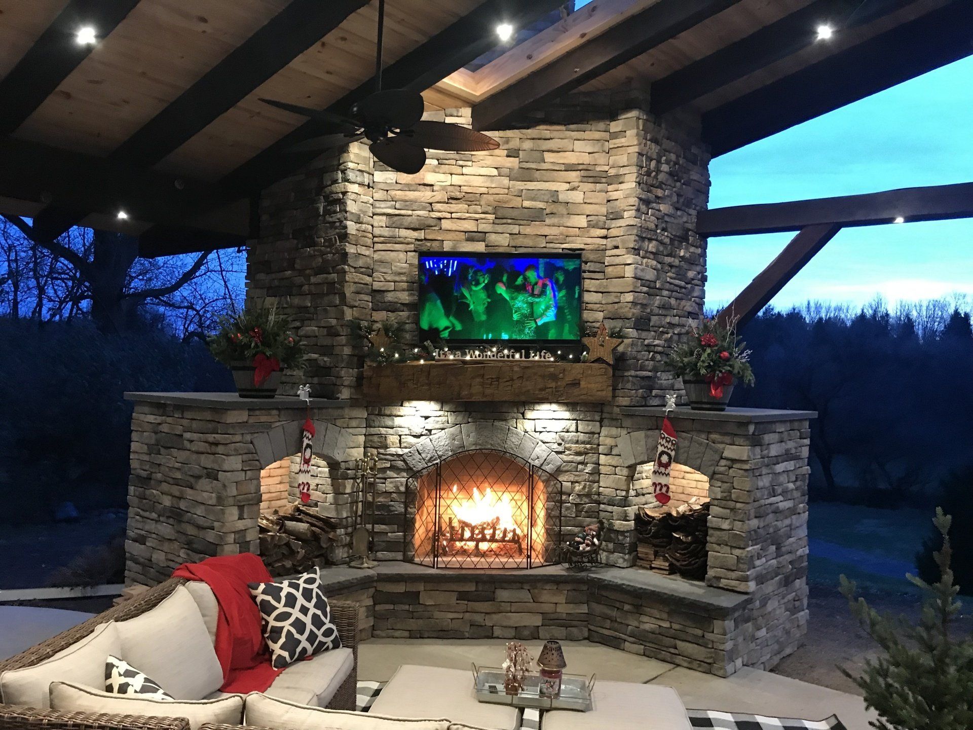 A living room with a fireplace and a flat screen tv.