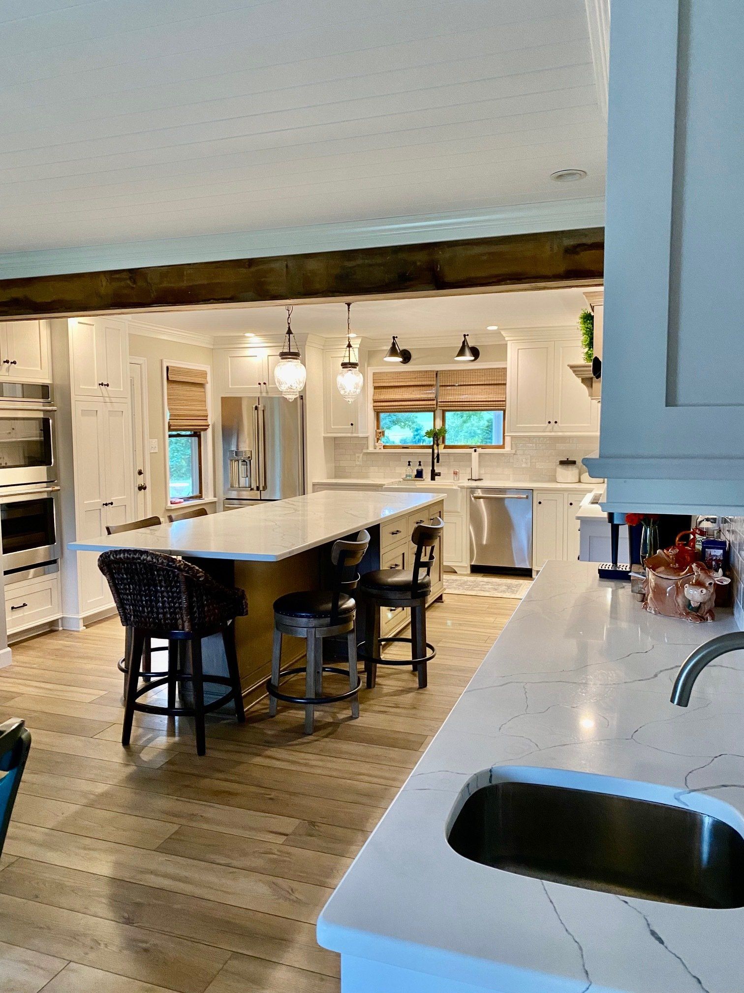 A kitchen with a large island and a sink