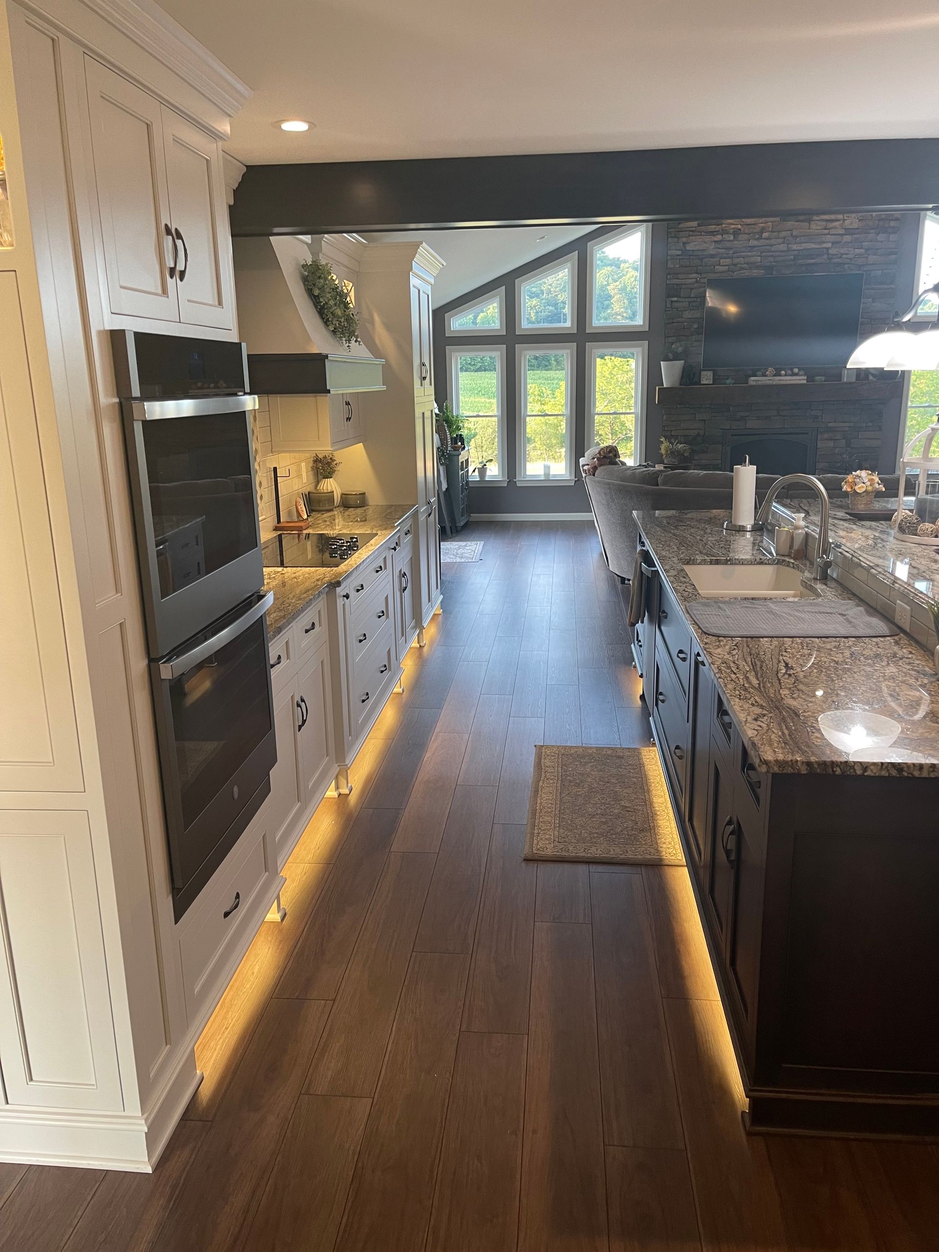 A kitchen with a lot of cabinets and a large island.