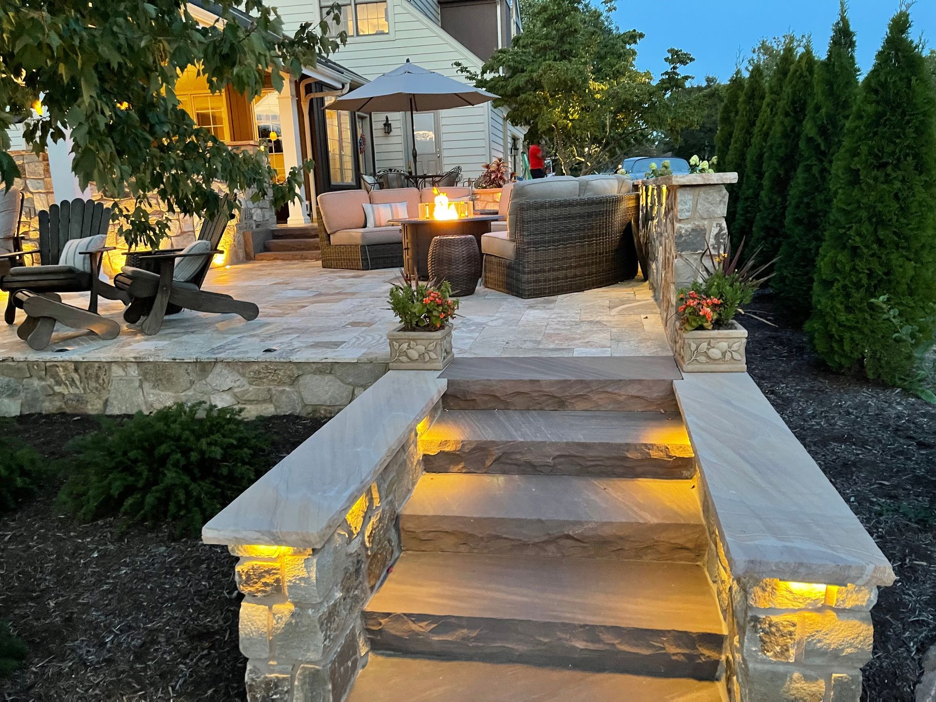 There is a fire pit in the middle of the patio.