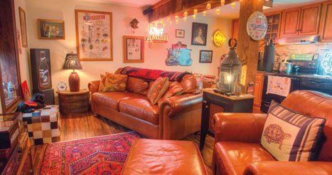 A living room filled with furniture and a fireplace.