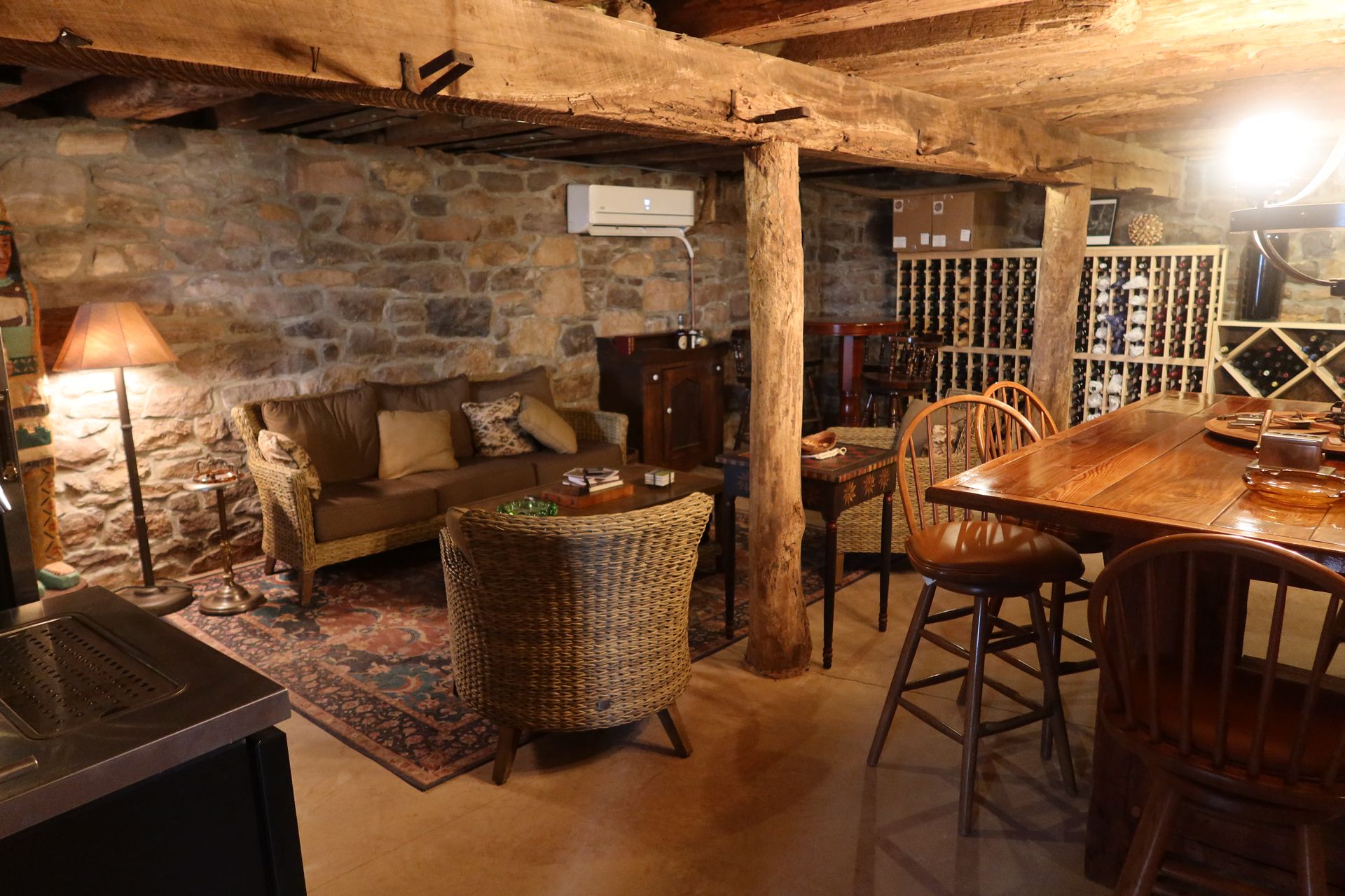 A living room with a couch , chairs and a table