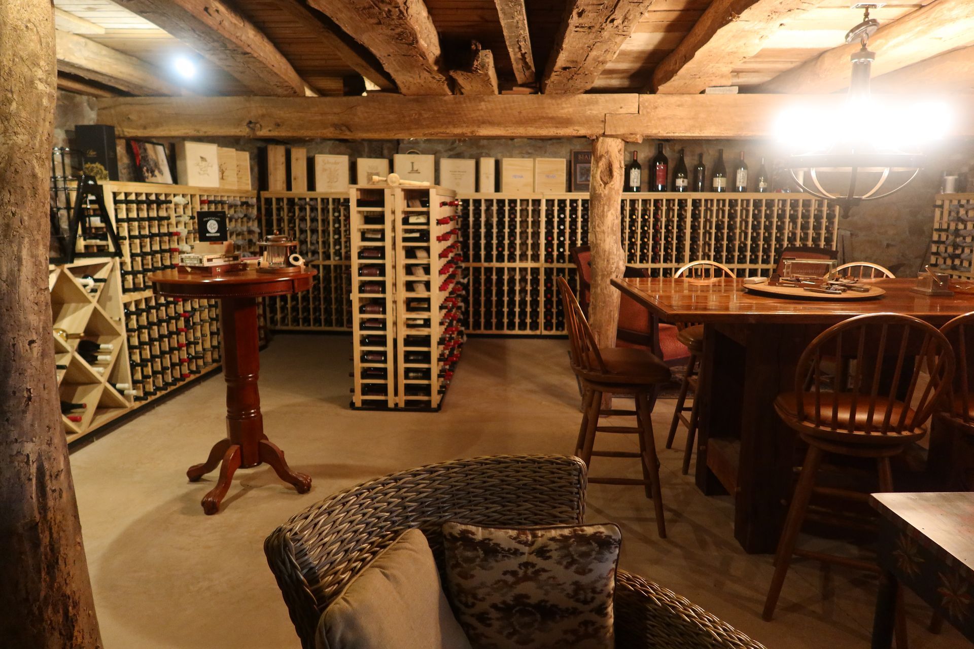 A wine cellar with a table and chairs in it