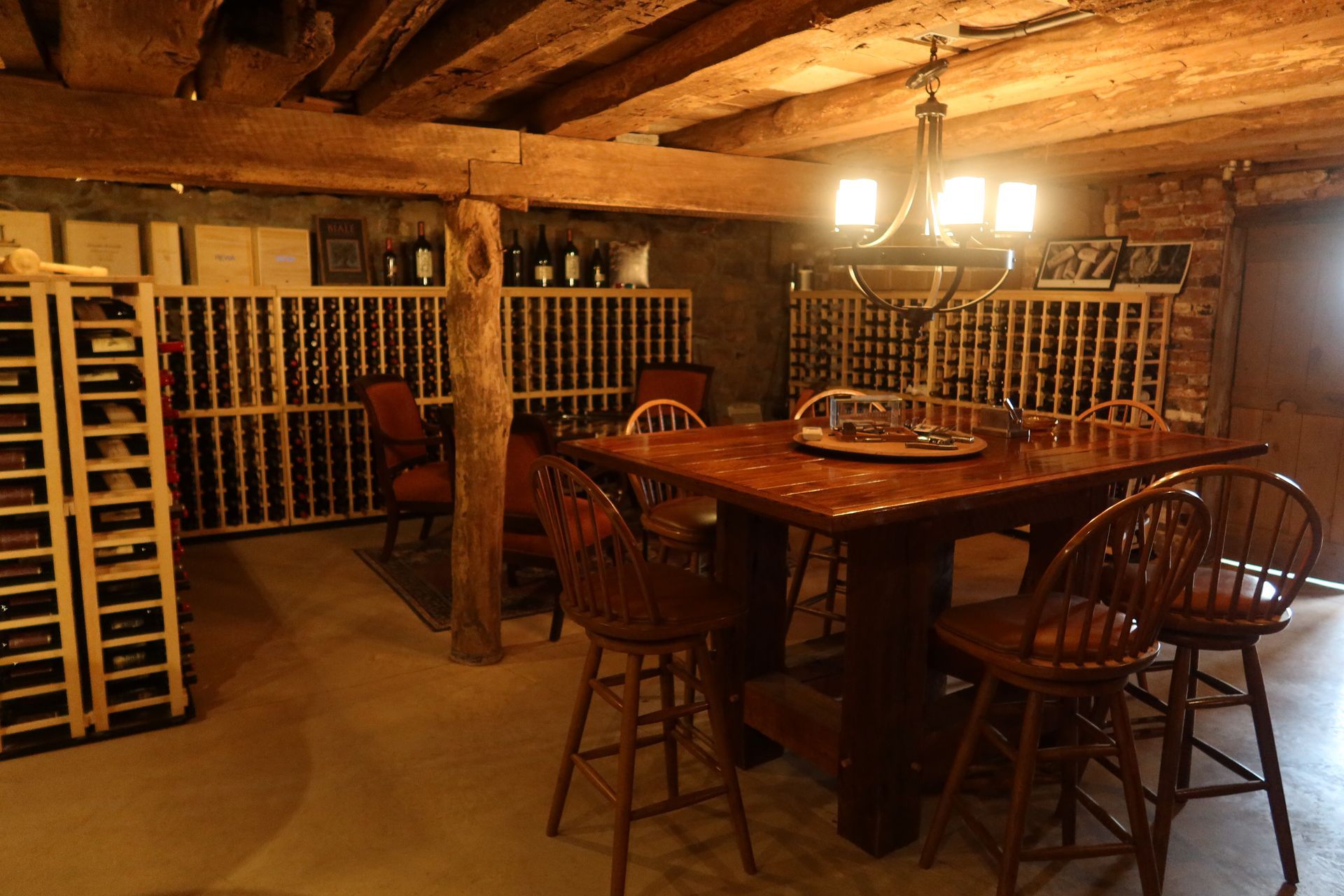 A wine cellar with a table and chairs in it