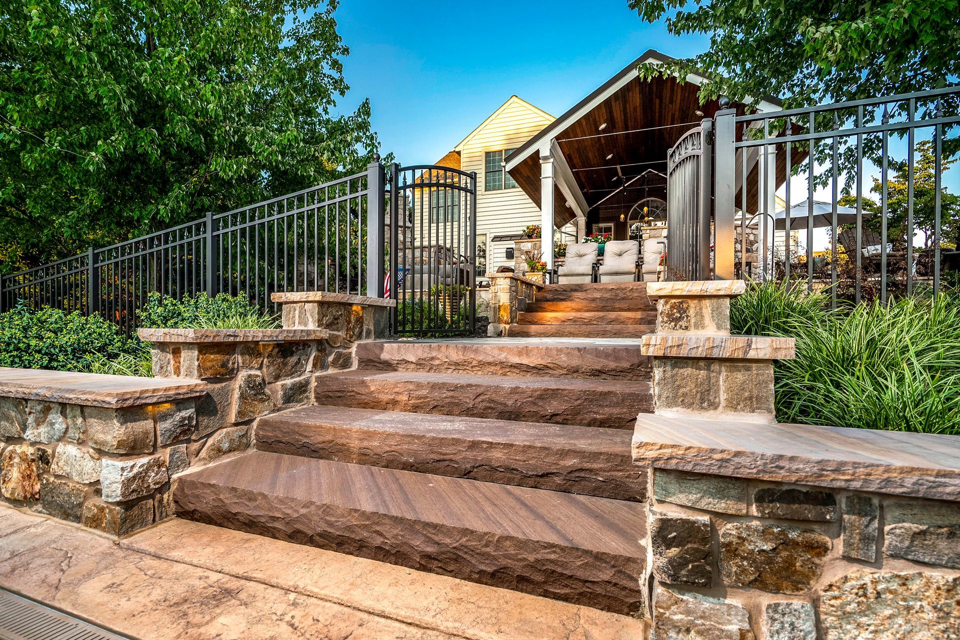 A set of stairs leading up to a building with a fence in the background.