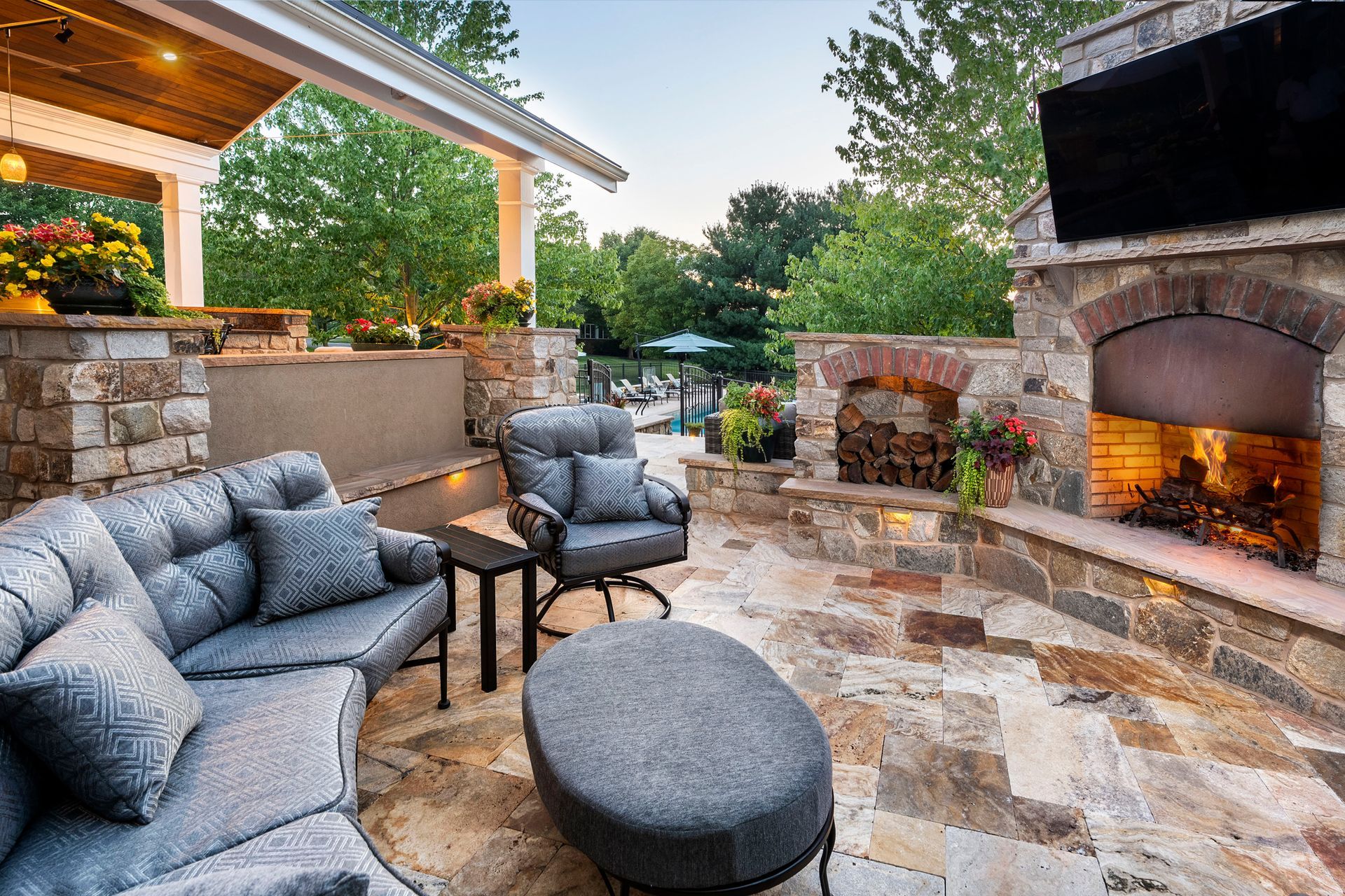 There is a fireplace in the middle of the patio.