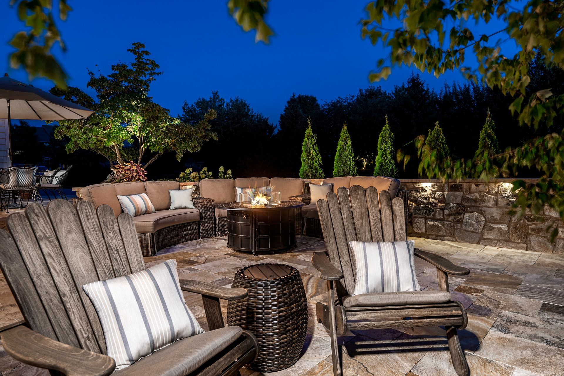 There is a fire pit in the middle of the patio.