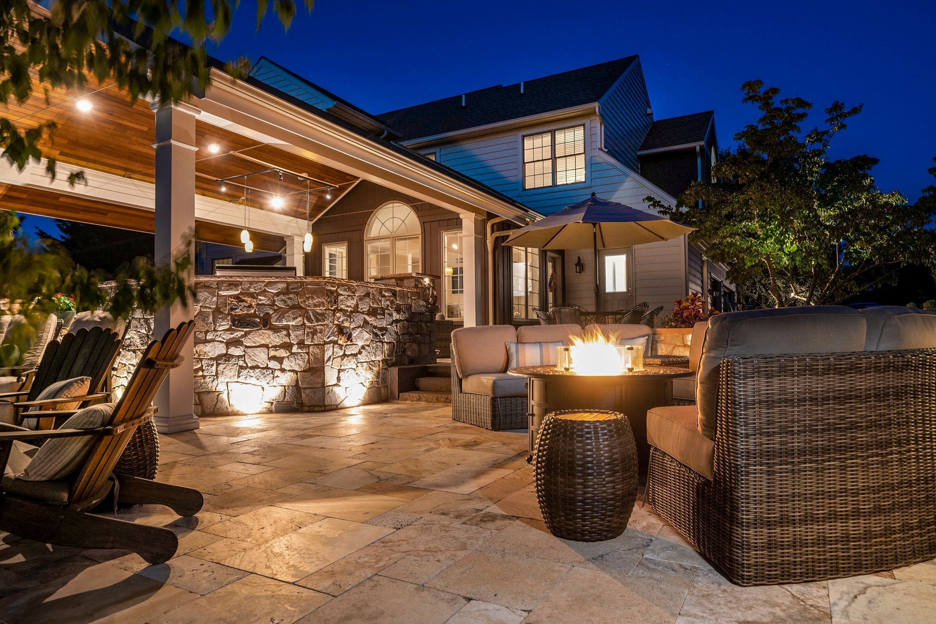 There is a fire pit in the middle of the patio.