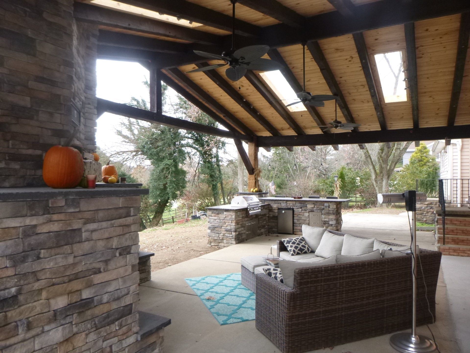 A living room with a couch and a ceiling fan