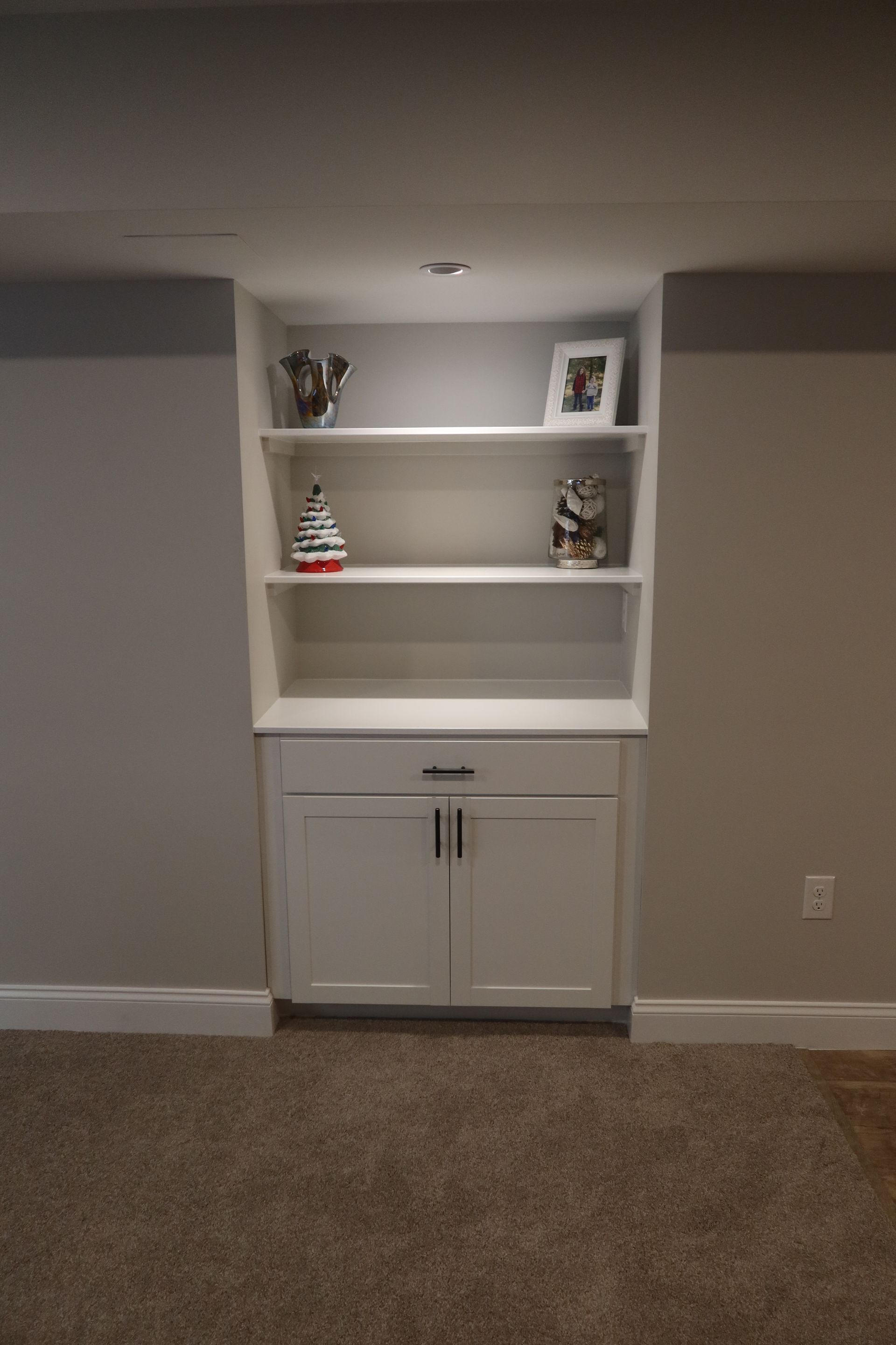 There is a bookshelf in the corner of the room.