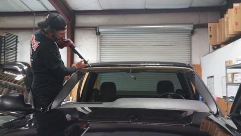 Auto Glass Repair — Man Repairing Car in Snellville, GA