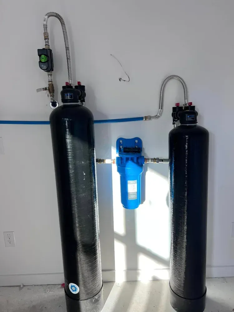 Two black cylinders with a blue filter attached to them