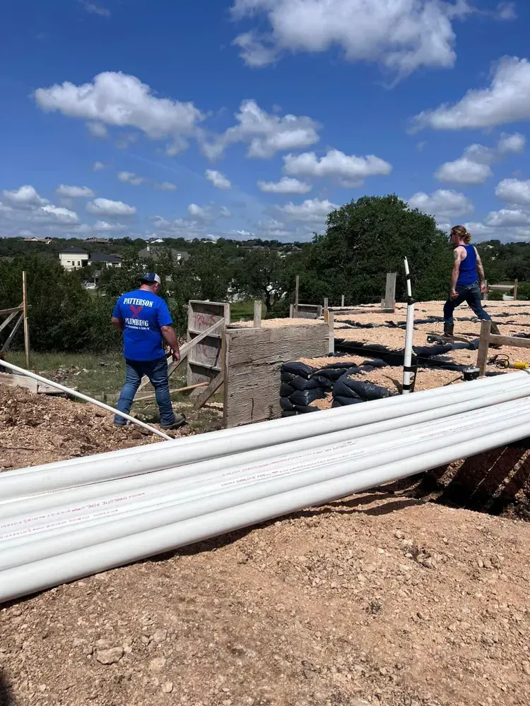 A man and a woman are working on a construction site.