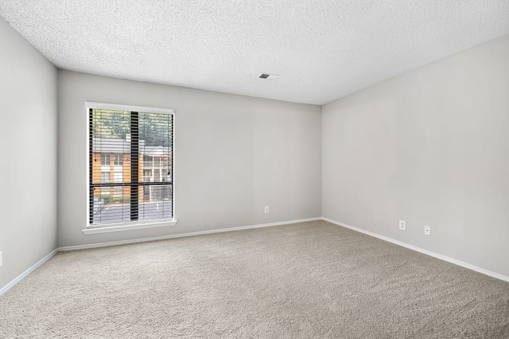 An empty room with a large window at Marquis at Perimeter Center in Atlanta, GA.