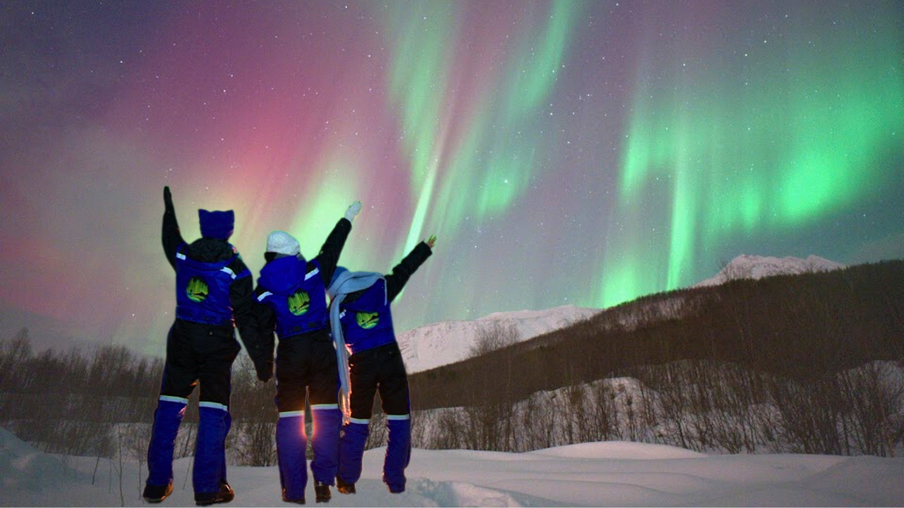 couples under aurora northern light in tromso norway