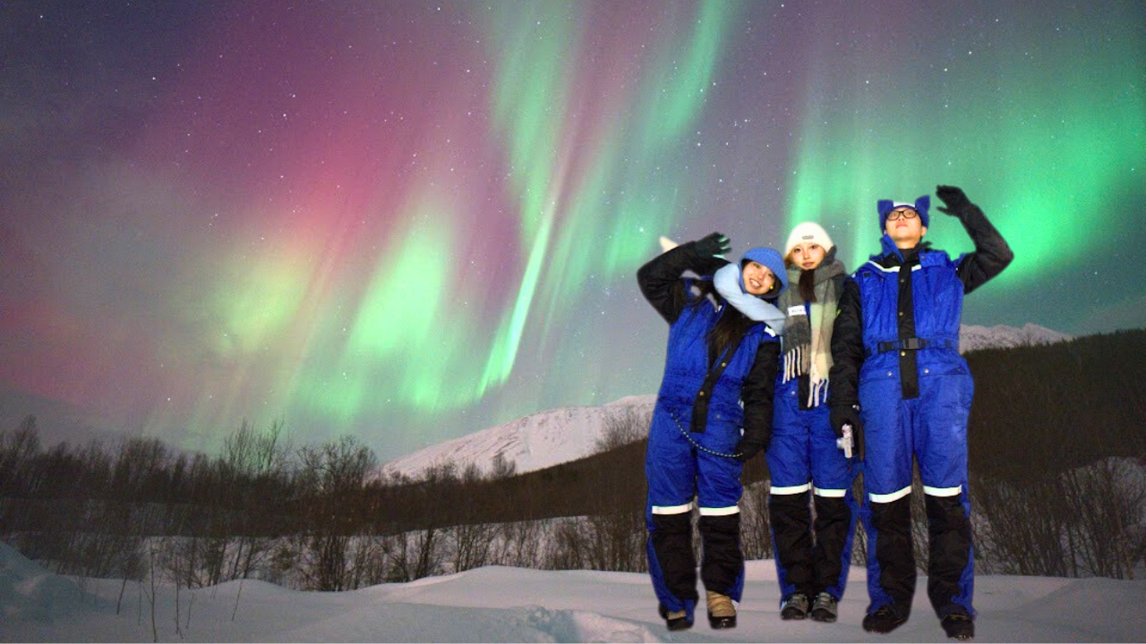couples under aurora northern light in tromso norway