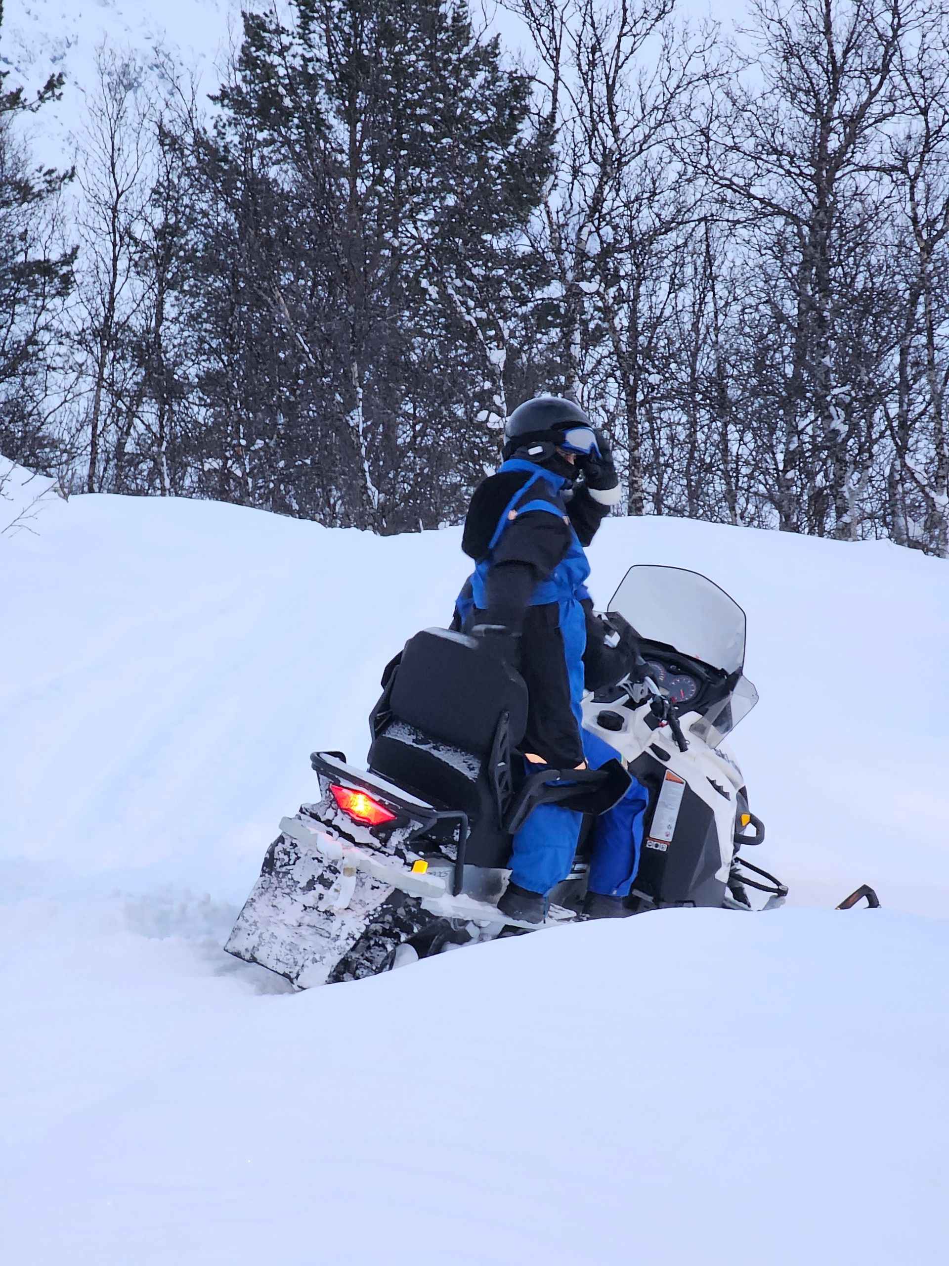 Snowmobile activity in Tromso city people dressed in winter clothing 