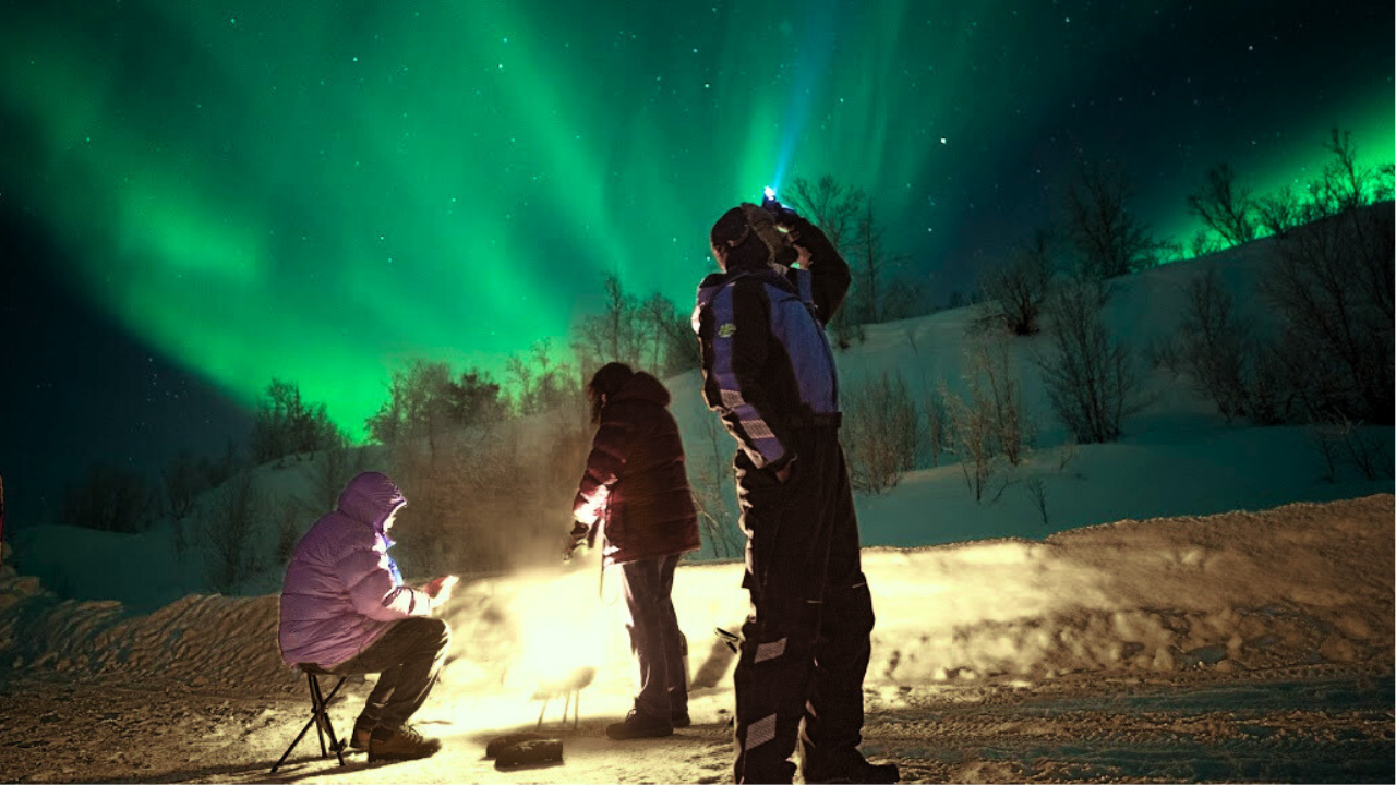 couples under aurora northern light in tromso norway