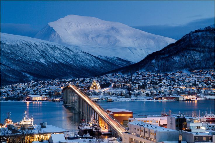 Tromso bridge and Tromso cathedral norway landscape photo covered in snow