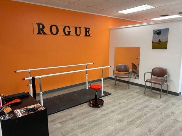 A room with a rogue sign on the wall