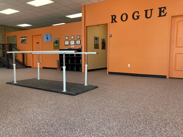 A room with a rogue sign on the wall
