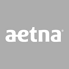 The aetna logo is white on a gray background.