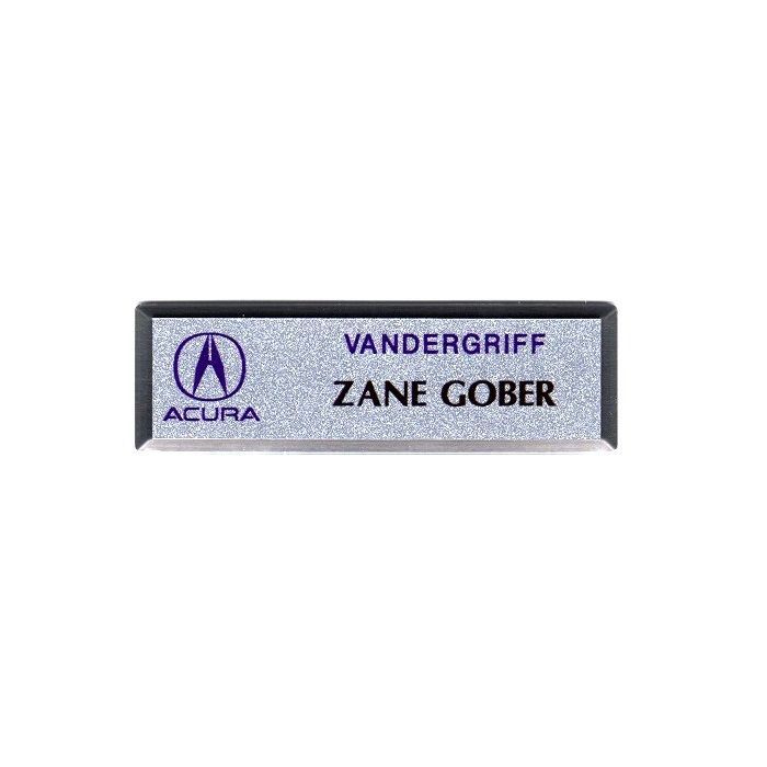 Silver thermal printed plastic name badge, set in silver premier frame.