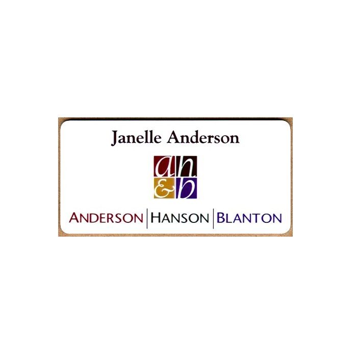 White thermal printed plastic name badge with company logo and name.