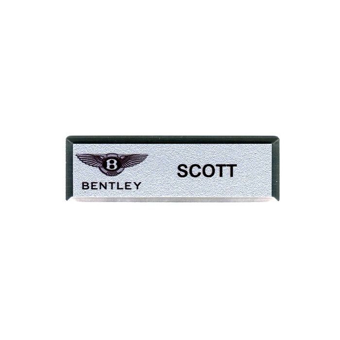 Silver thermal printed plastic name badge, set in silver premier frame.