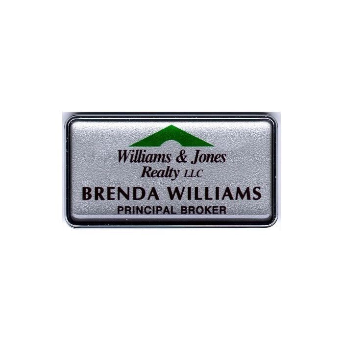 Silver thermal printed plastic name badge with protective dome, set in silver executive frame.