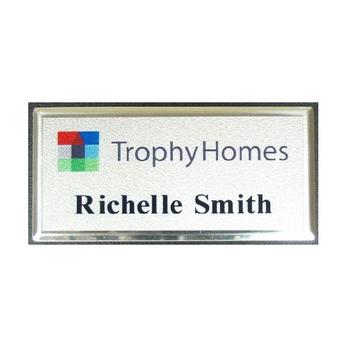 Silver thermal printed plastic name badge, set in silver premier frame.