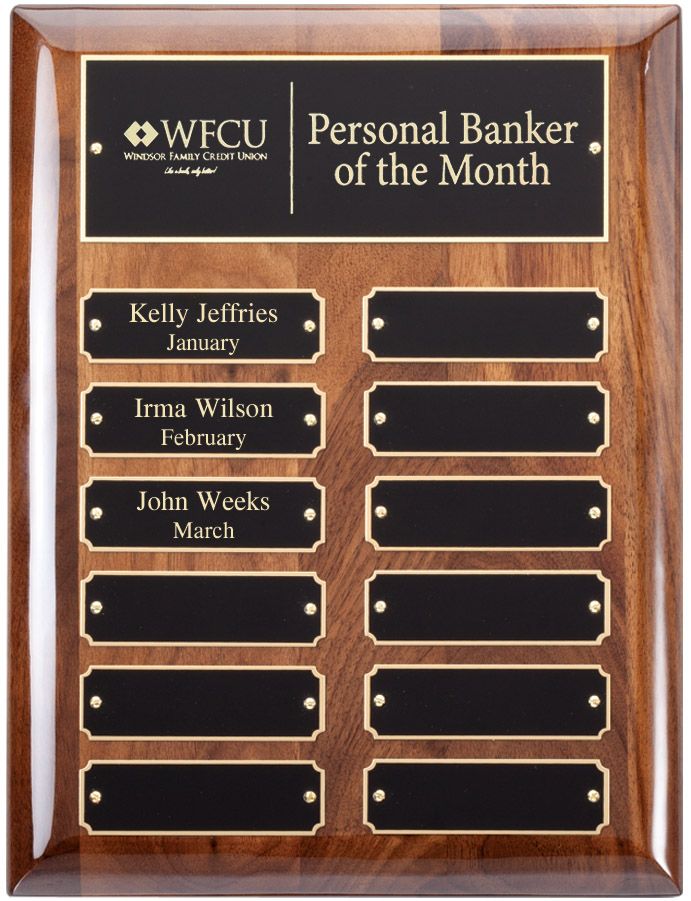 Wood finish perpetual recognition plaque with gold accents.