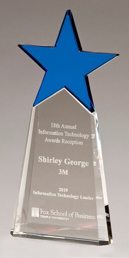 Crystal recognition award with blue star.