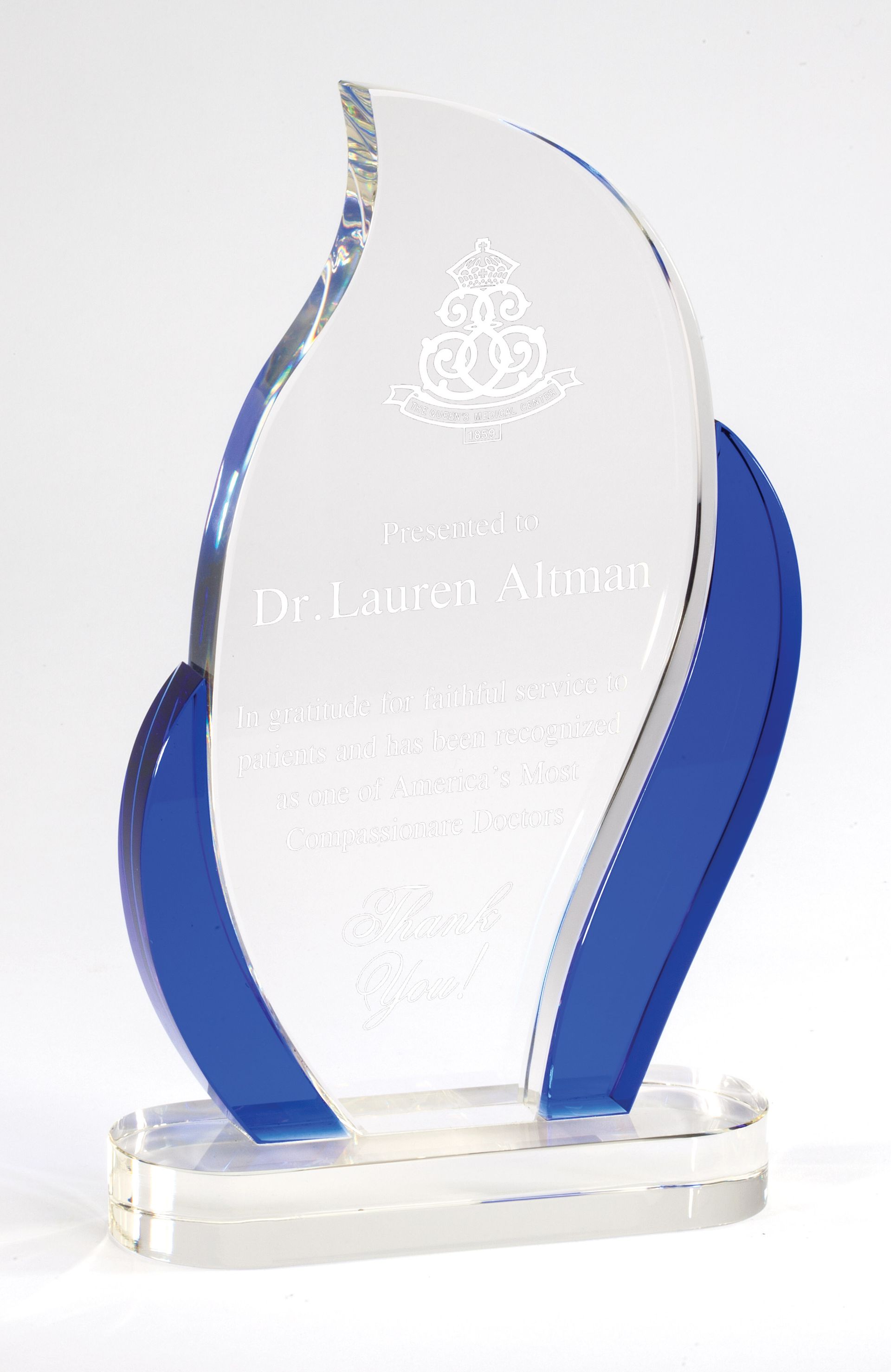Flame shape crystal award with blue accents.
