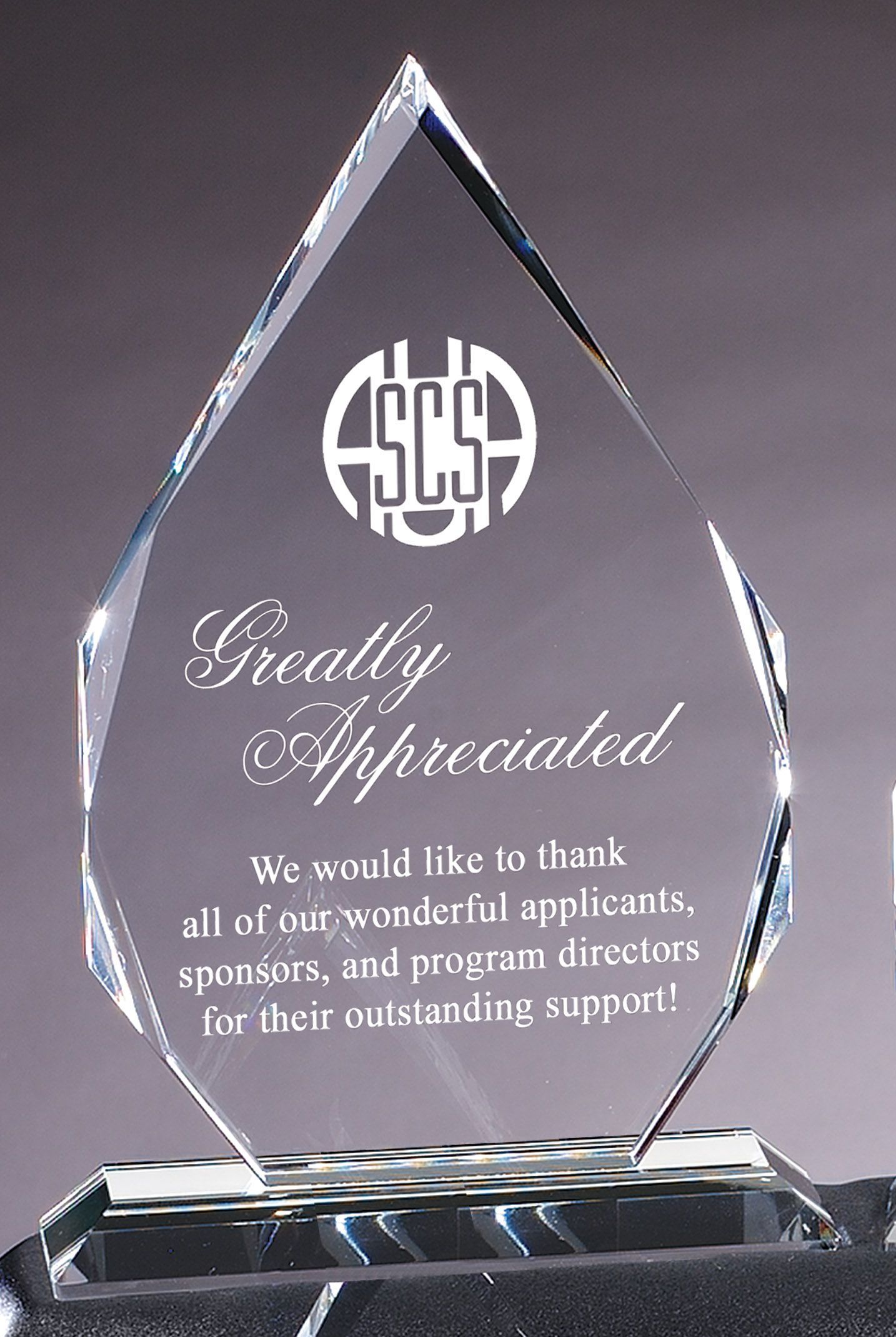 Faceted teardrop shape crystal recognition award.