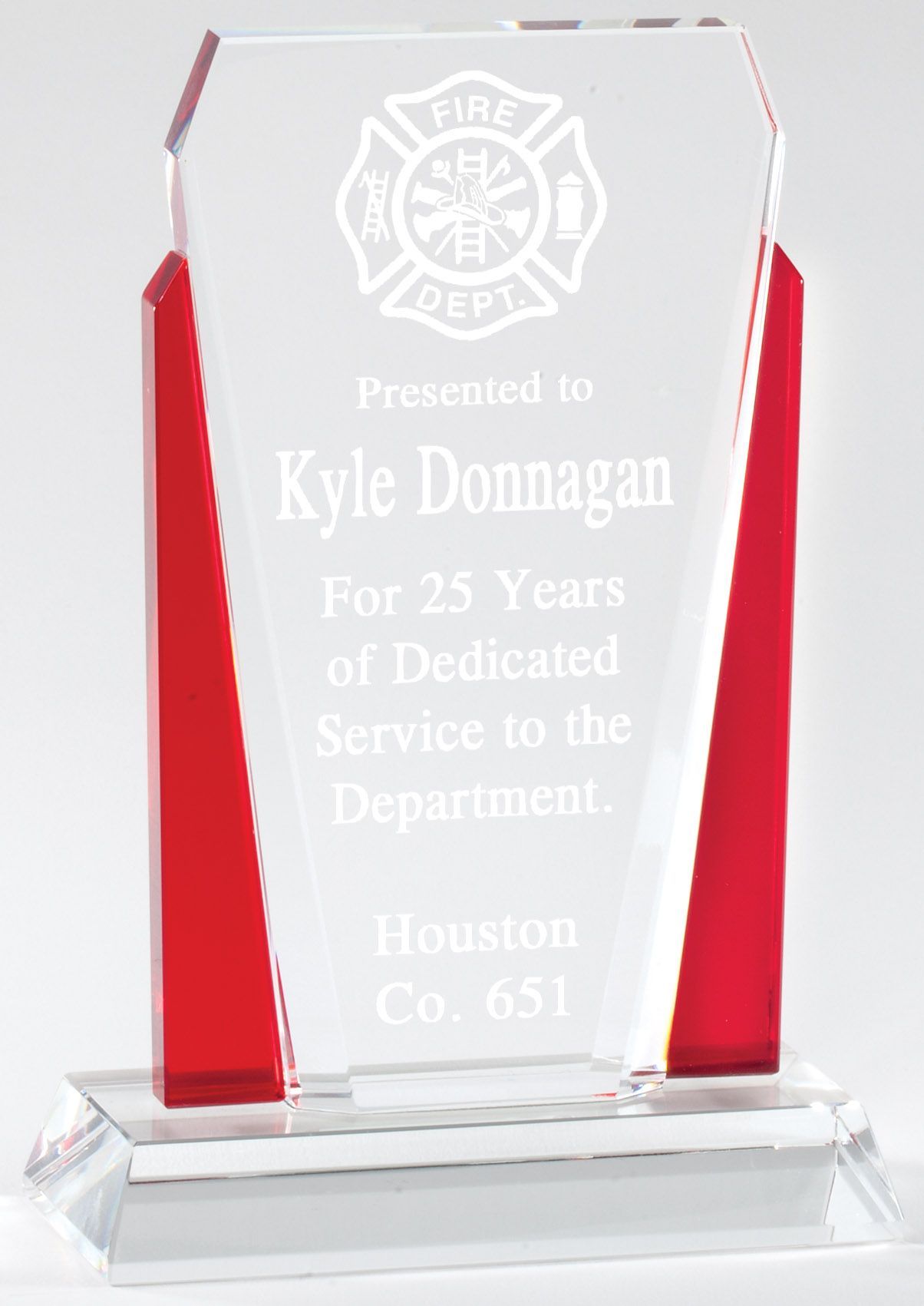 Crystal with red recognition award.