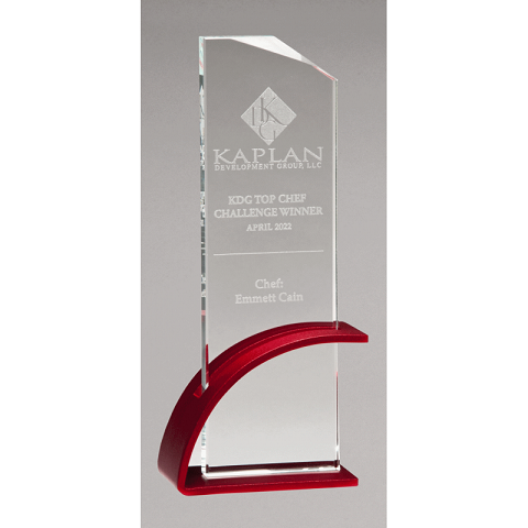 Glass award with red base.