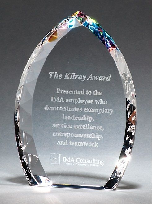 Crystal flame shaped recognition award with jeweled edge and prism effect.