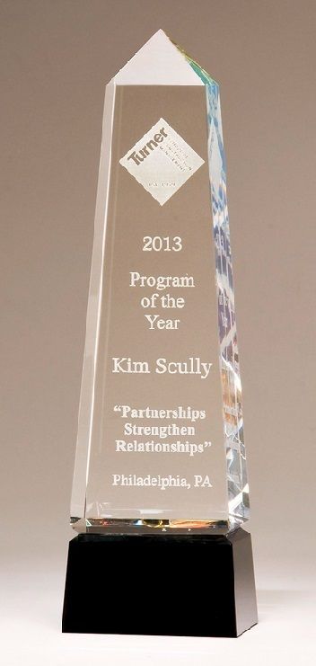 Crystal obelisk recognition award with prism effect.