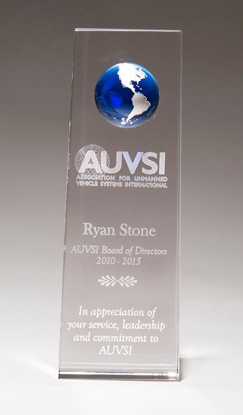 Crystal trophy featuring blue globe.
