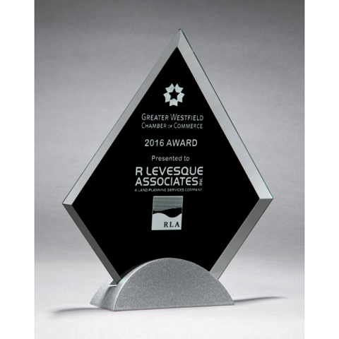 Diamond shaped glass recognition award with black background.