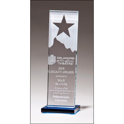 Etched glass recognition award with star and mountain.