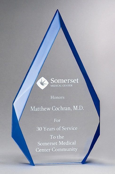 Clear acrylic recognition award with blue accent.